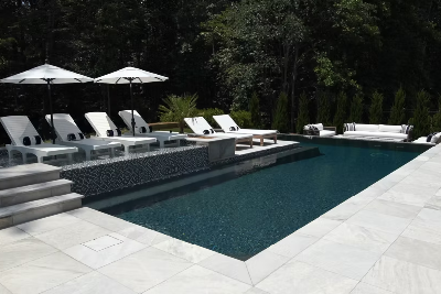 L-Shaped Pool Framed in Marble