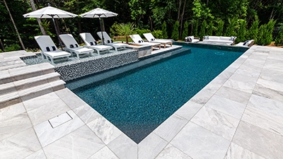 L-Shaped Pool Framed in Marble