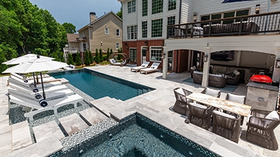 L-Shaped Pool Framed in Marble