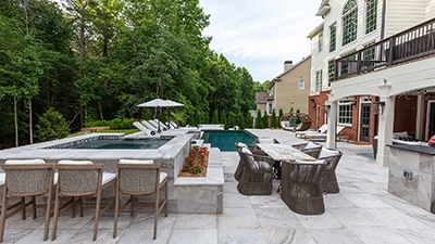 L-Shaped Pool Framed in Marble