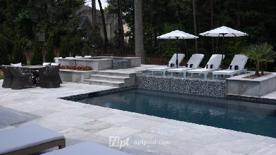 L-Shaped Pool Framed in Marble